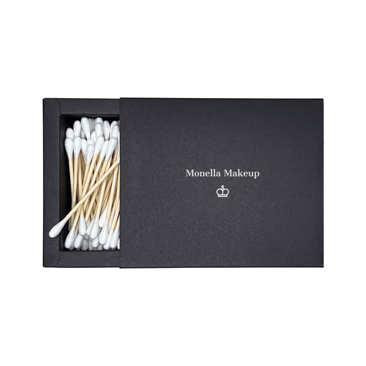 Biodegradable cotton swabs in black Monella Makeup box with bamboo stems and pure cotton tips, ideal for makeup application and removal.